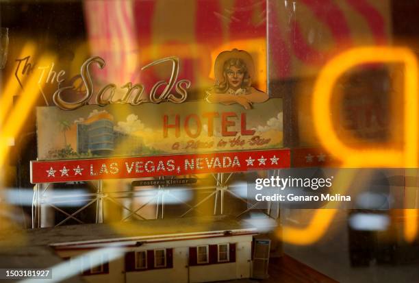 Neon reflects on the plastic casing of a miniature of the Sands Hotel created for the Francis Ford Coppola movie, "One From The Heart," and will be...
