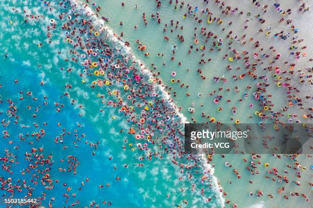 Aerial view of tourists cooling off at a water park in summer on June 27, 2023 in Zhengzhou, Henan Province of China. Zhengzhou Meteorological...