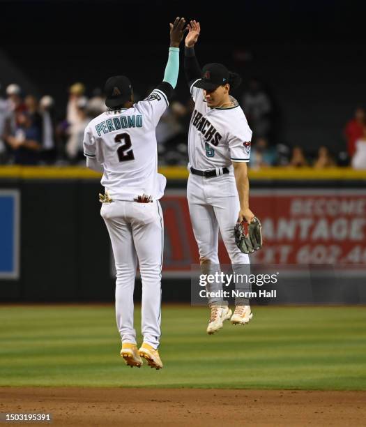 Alek Thomas and Geraldo Perdomo of the Arizona Diamondbacks celebrate an 8-4 win against the Tampa Bay Rays at Chase Field on June 27, 2023 in...