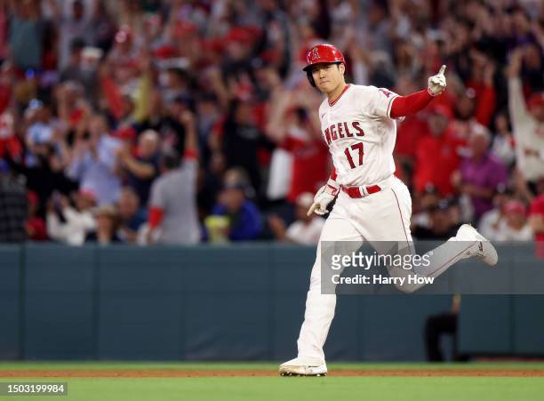 Shohei Ohtani of the Los Angeles Angels celebrates his solo homerun, to take a 3-1 lead over the Chicago White Sox, during the seventh inning at...