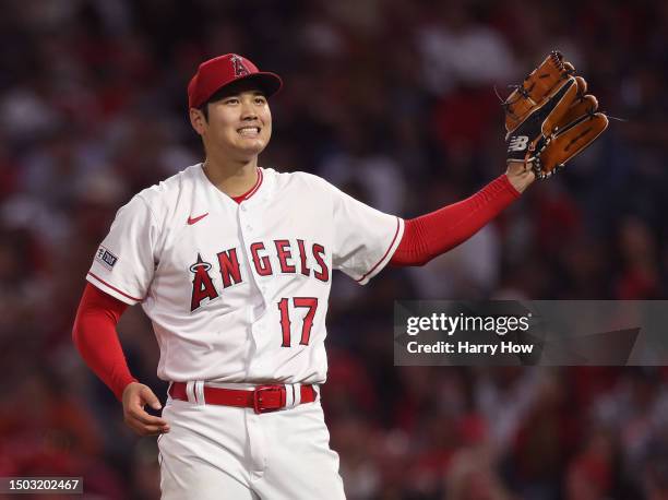 Shohei Ohtani of the Los Angeles Angels reacts after his pitch during the seventh inning against the Chicago White Sox at Angel Stadium of Anaheim on...