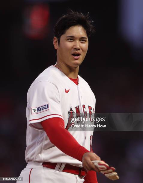 Shohei Ohtani of the Los Angeles Angels reacts on base as he waits during a timeout in the fifth inning against the Chicago White Sox at Angel...