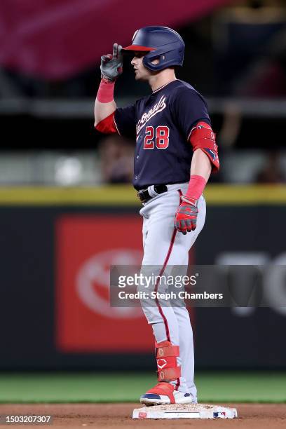 Lane Thomas of the Washington Nationals celebrates his two-run RBI double against the Seattle Mariners during the eleventh inning at T-Mobile Park on...