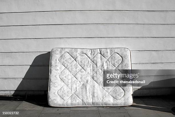 old mattress on street - mattress stock pictures, royalty-free photos & images