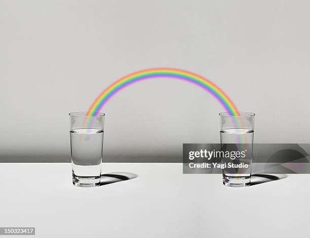 the cup filled with water and a rainbow - drinking water stock illustrations