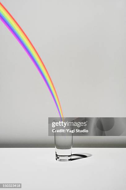 ilustrações, clipart, desenhos animados e ícones de the cup filled with water and a rainbow - esperança conceito