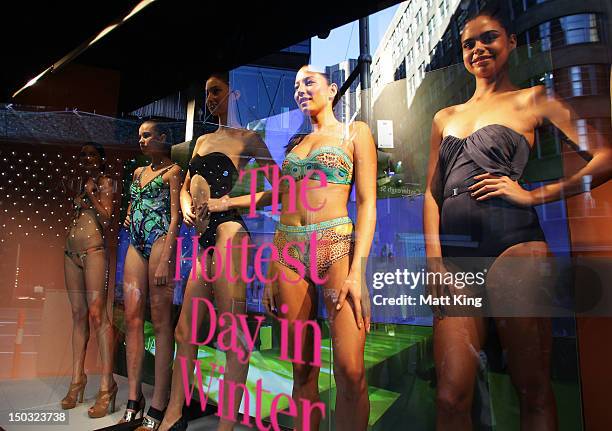 Alexandra Agoston , Jessica Gomes and Samantha Harris showcase swimwear designs at the David Jones Elizabeth Street Store on August 16, 2012 in...