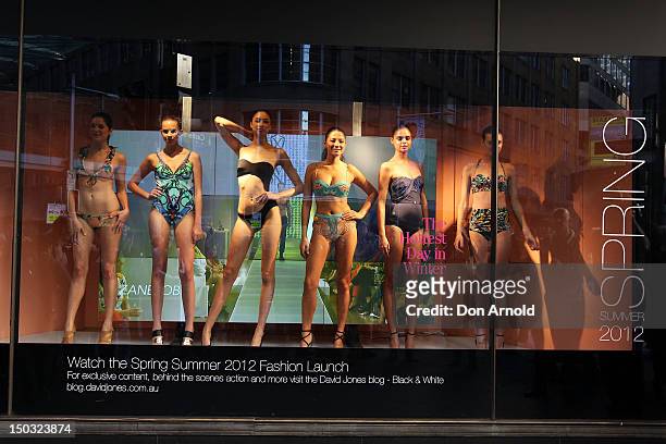 Models showcase designs as part of the David Jones Hottest Day In Winter Swimwear display at David Jones Elizabeth Street Store on August 16, 2012 in...