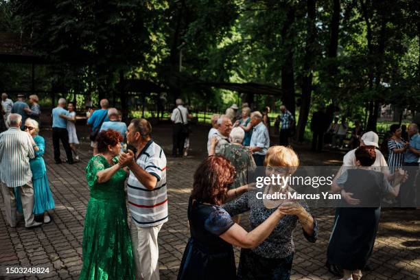 Halyna and Kateryna, last names not given, dance as they join other elderly residents who come out every weekend to dance together during summertime...