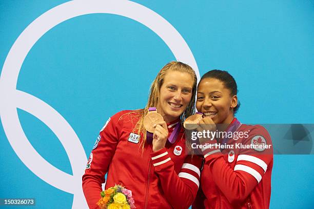 Summer Olympics: Canada Emilie Heymans and Jennifer Abel victorious on medal stand after winning Women's Synchronized 3M Springboard bronze at...