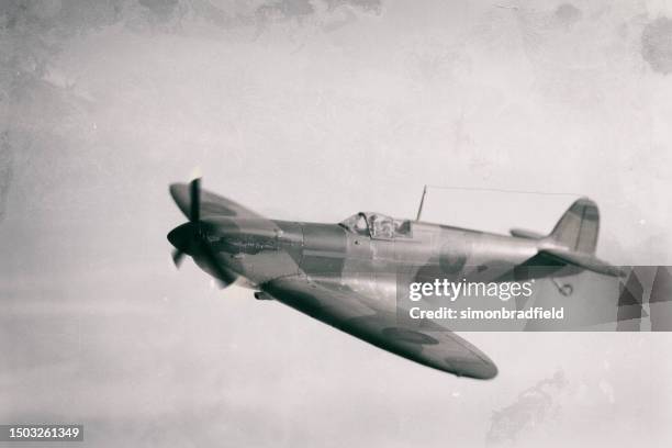 model spitfire in flight - air attack stock pictures, royalty-free photos & images