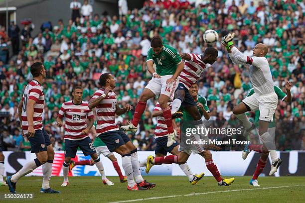 Timothy Howard of the United States jumps for the ball during a FIFA friendly match between Mexico and US at Azteca Stadium on August 15, 2012 in...