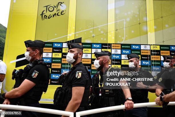 French gendarmes stand by the podium area after the 5th stage of the 110th edition of the Tour de France cycling race, 163 km between Pau and Laruns,...