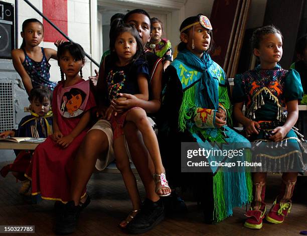 Young American Indians, some in traditional dress, attend the "Back-to-School" Pow-Wow at the American Indian Center in Chicago, Illinois, on August...