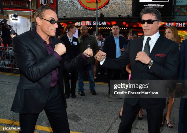 Actor Jean-Claude Van Damme and Actor/Writer/Director Sylvester Stallone arrive at Lionsgate Films' "The Expendables 2" premiere on August 15, 2012...