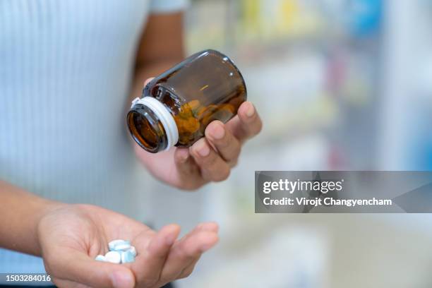 taking medication - 5 pieces stock pictures, royalty-free photos & images