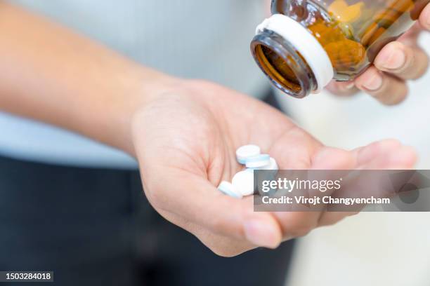 taking medication - 5 pieces stock pictures, royalty-free photos & images