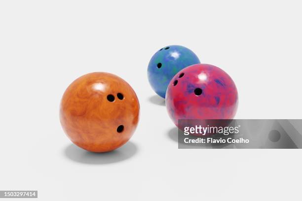 three bowling balls on white background - bowling ball stock pictures, royalty-free photos & images