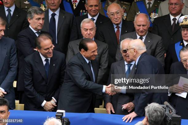 Former Prime Minister Silvio Berlusconi greets the President of the Republic Giorgio Napolitano on Republic Day. In the photo also the former...