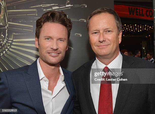 Composer Brian Tyler and Co-Chairman of Lionsgate Michael Burns arrive at "The Expendables 2" Los Angeles Premiere at Grauman's Chinese Theatre on...