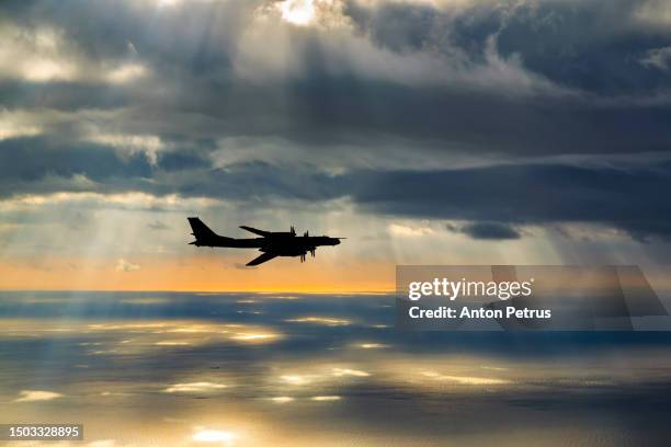 russian strategic bomber over the caspian sea - missile defense command stock pictures, royalty-free photos & images