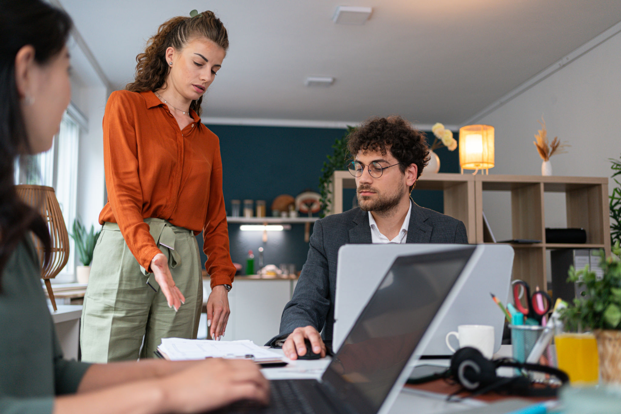 Female manager, having a consultation with multiracial coworkers at the office Female manager, having a consultation with multiracial coworkers at the office