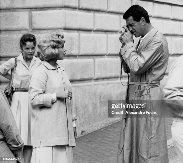 Actor Rock Hudson takes the picture of actress Sandra Dee for a scene of the film 'Come September', at Portofino, Italy, in 1960.