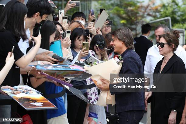 Actor Tom Cruise waves to his fans upon his arrival at Gimpo International Airport on June 28, 2023 in Seoul, South Korea. Tom Cruise is visiting...