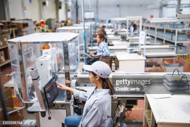 young women working on the production line in factory - industrial plant stock pictures, royalty-free photos & images