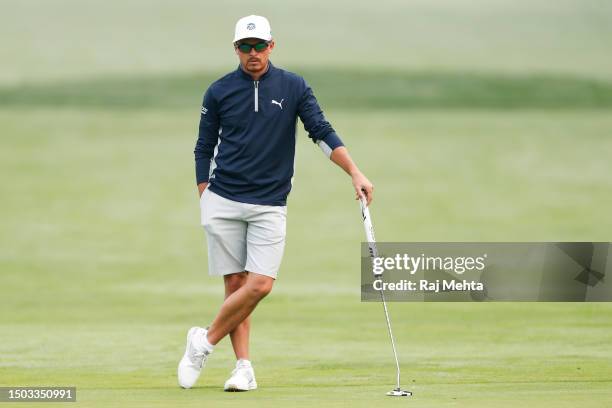 Rickie Fowler of the United States stands on the second green during a practice round prior to the Rocket Mortgage Classic at Detroit Golf Club on...