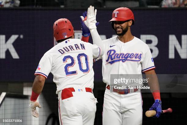 Ezequiel Duran of the Texas Rangers is congratulated by Leody Taveras after hitting a home run during the eighth inning against the Detroit Tigers at...