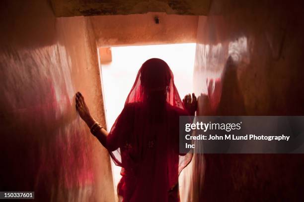 indian woman walking down stairs - india sari stock pictures, royalty-free photos & images