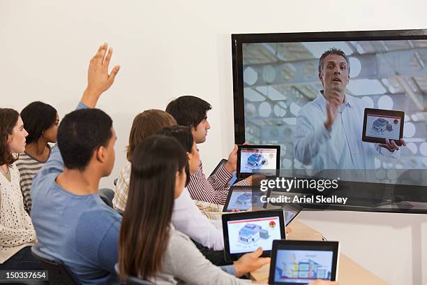 students using digital tablets with instructor on monitor - e learning teacher stock pictures, royalty-free photos & images