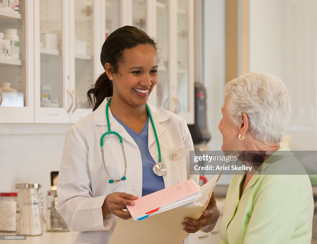 Doctor talking to patient in examination room