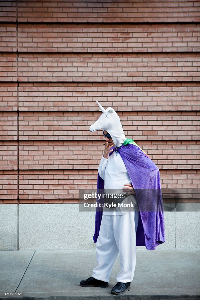 Caucasian man in unicorn costume