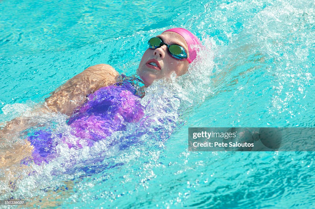 Caucasian woman swimming