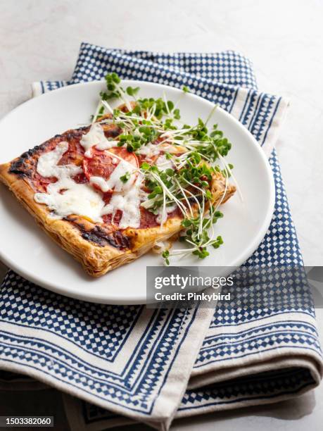 puff pastry pie with tomato sauce and mozarella, tomato quiche, tomato tart, pastry pita bread, puff pastry pizza with tomato sauce and microgreen - microgreens stock pictures, royalty-free photos & images