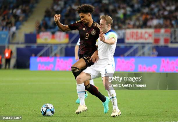 Kevin Schade of Germany battles for possession with Oliver Skipp of England during the UEFA Under-21 Euro 2023 match between England and Germany at...