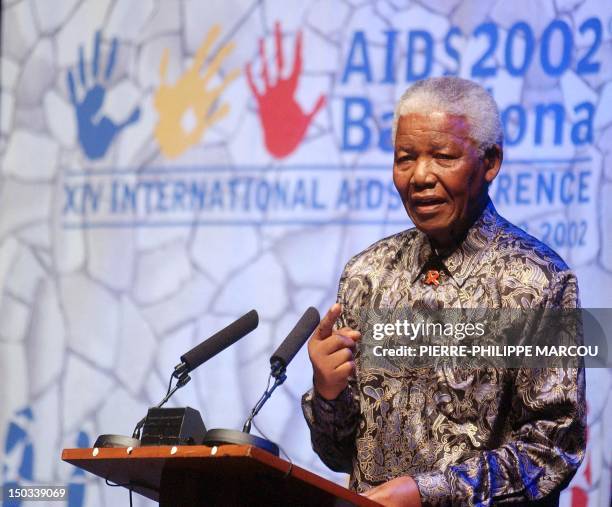 Former South African President Nelson Mandela speaks during the closing ceremony of the XIV International AIDS Conference 12 July 2002, in Barcelona....