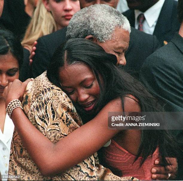 South African President Nelson Mandela hugs British supermodel Naomi Campbell at Genadendal, his Cape Town home, 13 February. Campbell has brought...