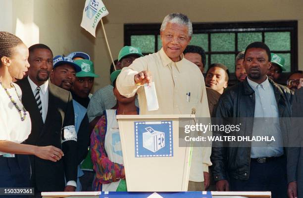 African National Congress President Nelson Mandela smiles broadly 27 April 1994 in Oshlange, black township near Durban, as he casts his historic...