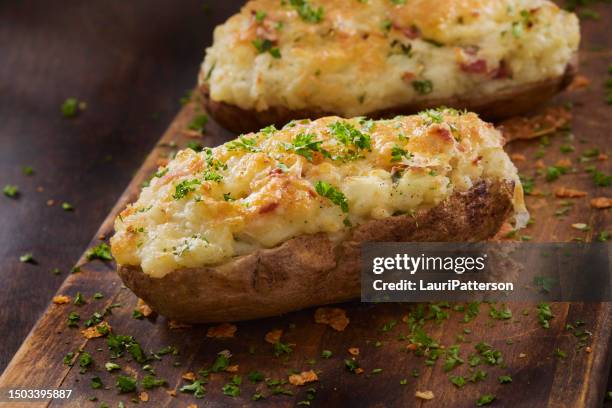 the viral smash bacon cheese burger taco - stuffed potato stock pictures, royalty-free photos & images