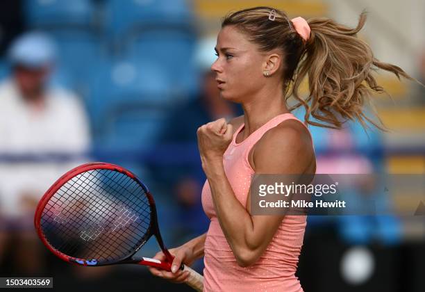 Camila Giorgi of Italy celebrates winning match point against Ons Jabeur of Tunisia during the Women's Singles Second Round match on Day Five of the...