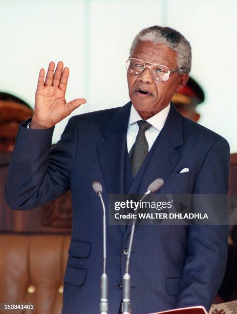 South African President Nelson Mandela takes the oath 10 May 1994 during his inauguration at the Union Building in Pretoria. Mandela was elected...