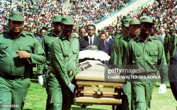 Members of Umkhonto We sizwe, the African National Congress' military wing, carry the coffin of the assassinated South African Communist Party leader...