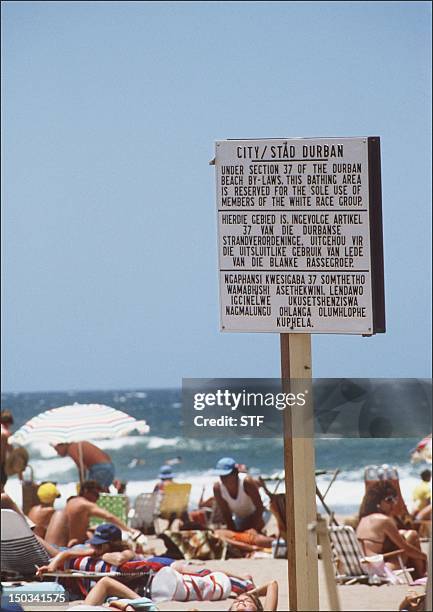 Photo dated 05 January 1987 of a notice board with the rules under which blacks were barred from swimming at the "Whites Only" section at a beach in...
