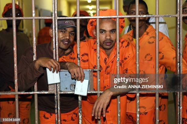 Inmates are pictured after voting at a polling staion in Pollsmoor Prison, Cape Town,14 April 2004. South Africans voted with enthusiasm Wednesday in...