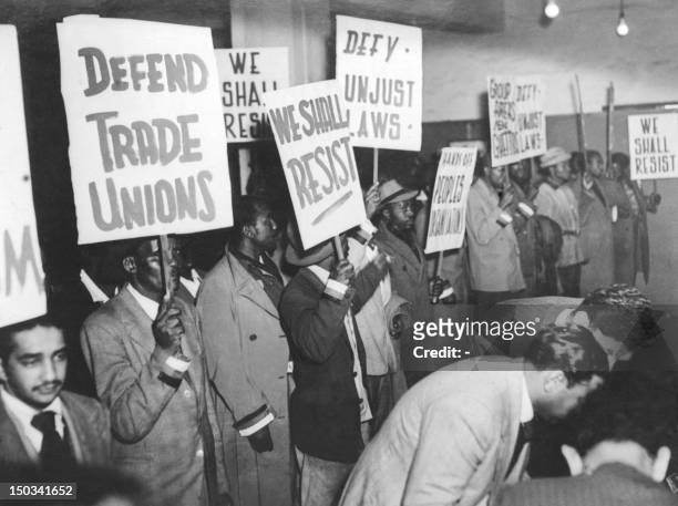 Supporters of South Africa's African National Congress , wearing on their sleeves the colors of their party, gather 12 August 1952 in Johannesburg as...
