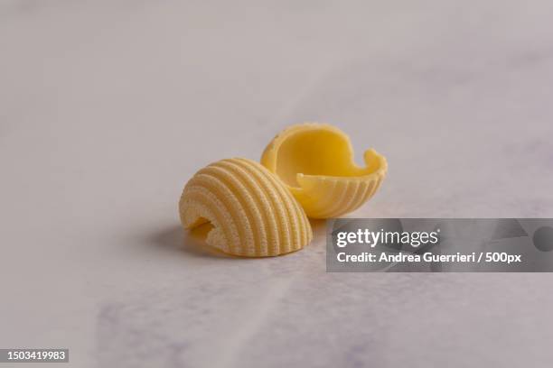 close-up of pasta on table,san severo,foggia,italy - conchiglie photos et images de collection