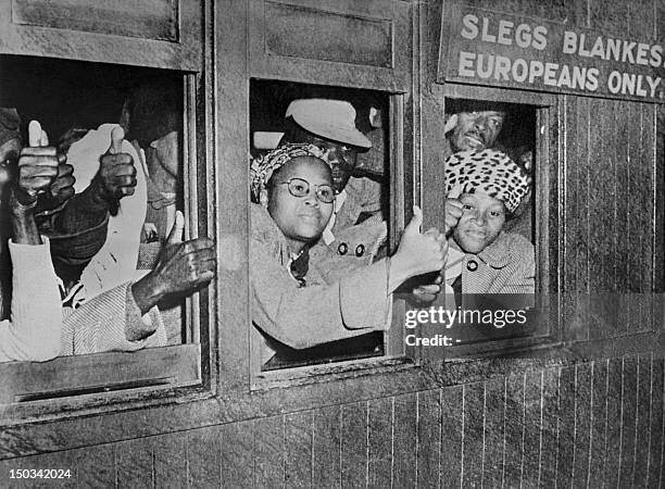 Black South African protesters take part in the civil disobedience campaign by occupying places for white people in public transports in...